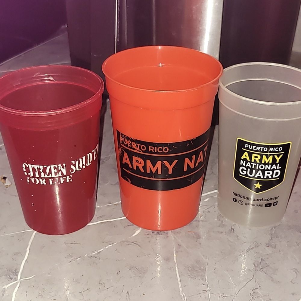 Three Army plastic cups
